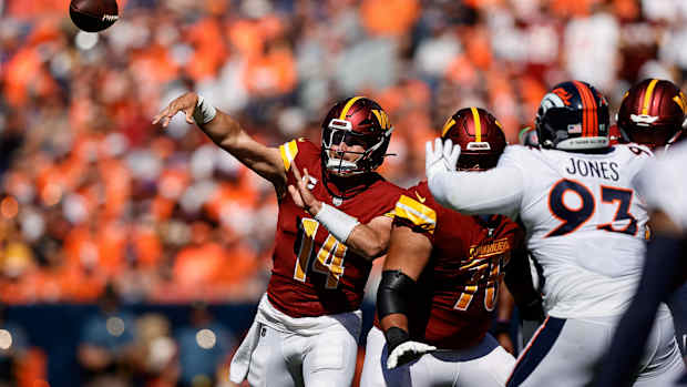 Sep 17, 2023; Denver, Colorado, USA; Washington Commanders quarterback Sam Howell (14) attempts a pass as offensive tackle Sam Cosmi (76) defends against Denver Broncos defensive tackle D.J. Jones (93) in the first quarter at Empower Field at Mile High. Mandatory Credit: Isaiah J. Downing-USA TODAY Sports